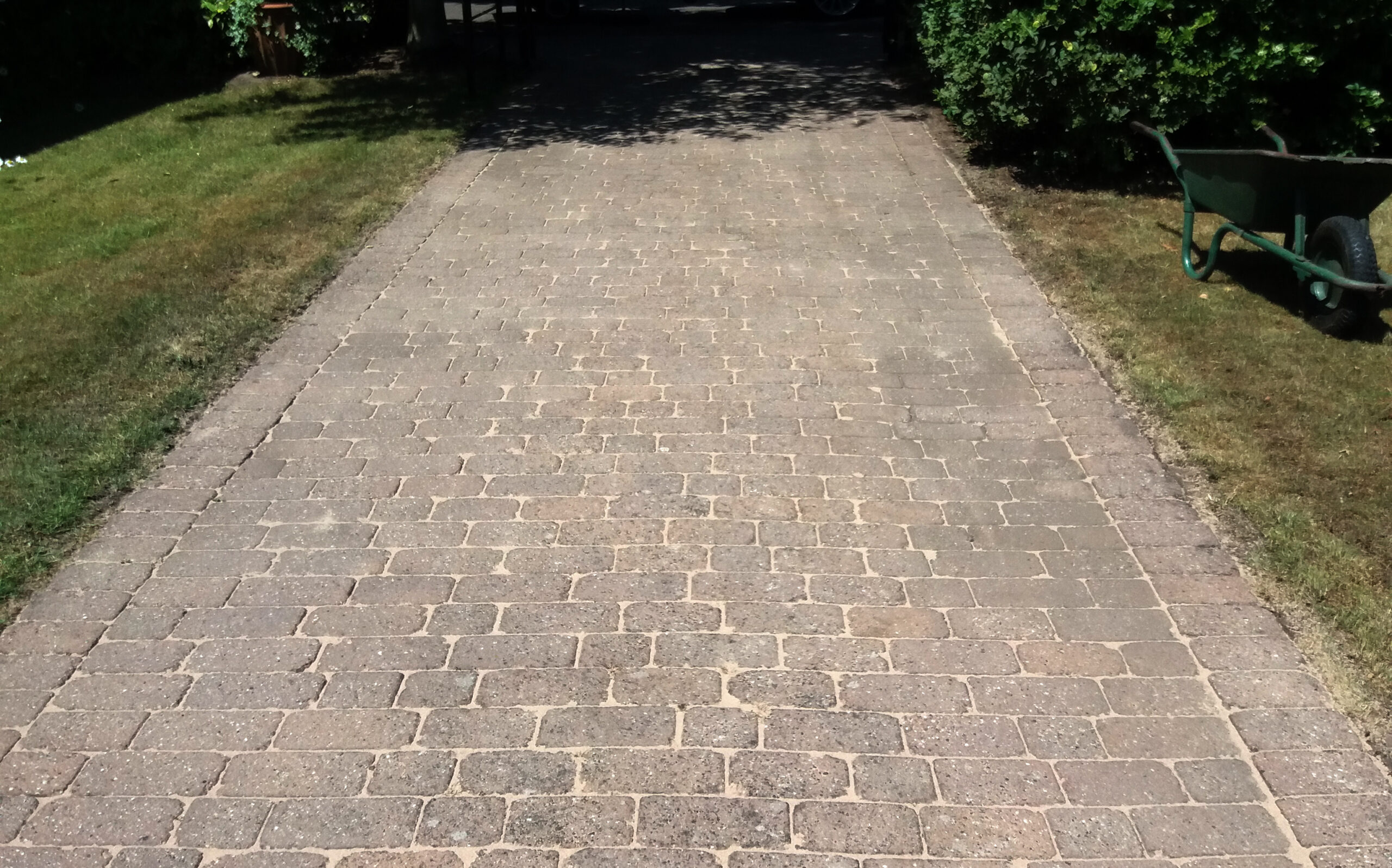 Cleaned block paving driveway freshly re-sanded with kiln-dried sand in Balderton